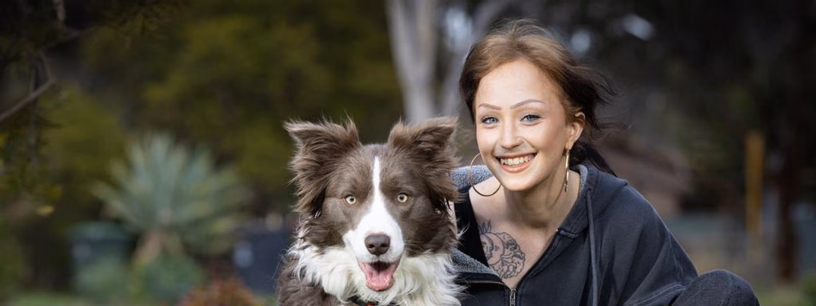 A support worker and a participant talking together at home